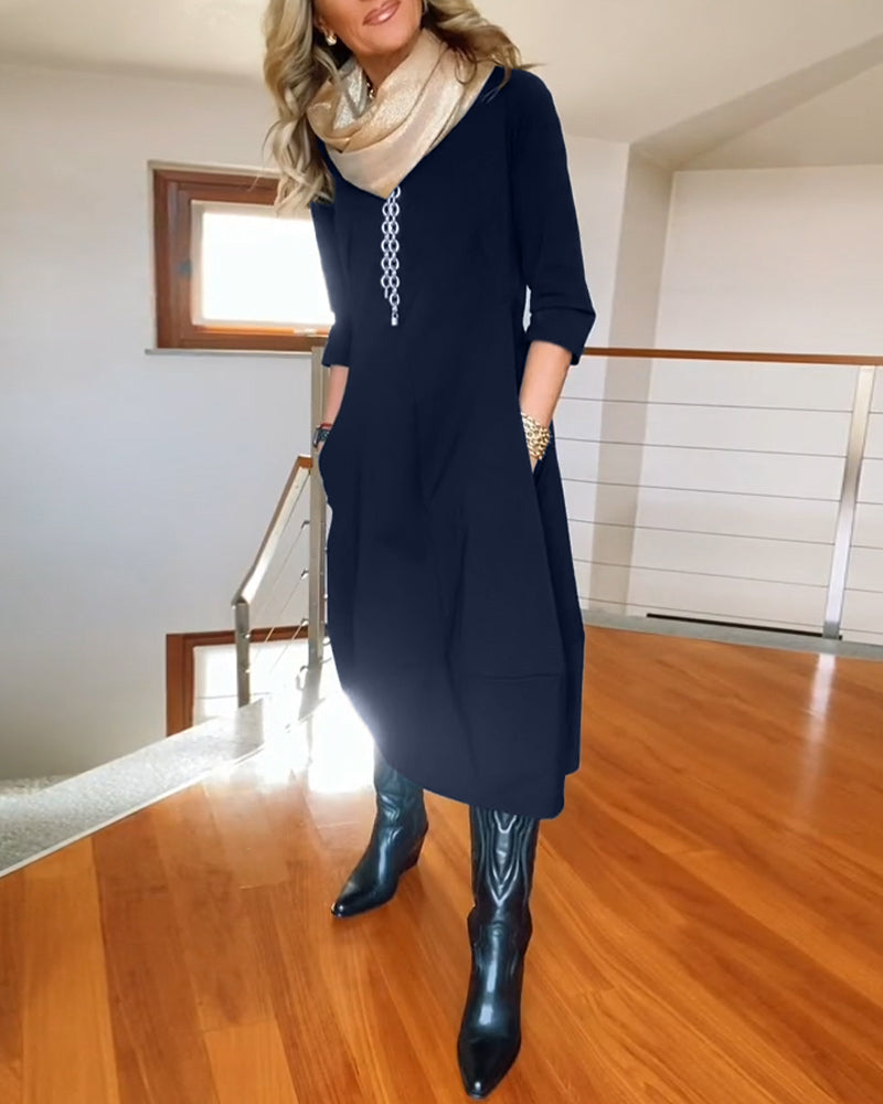 Robe élégante de couleur unie avec poche et col rond