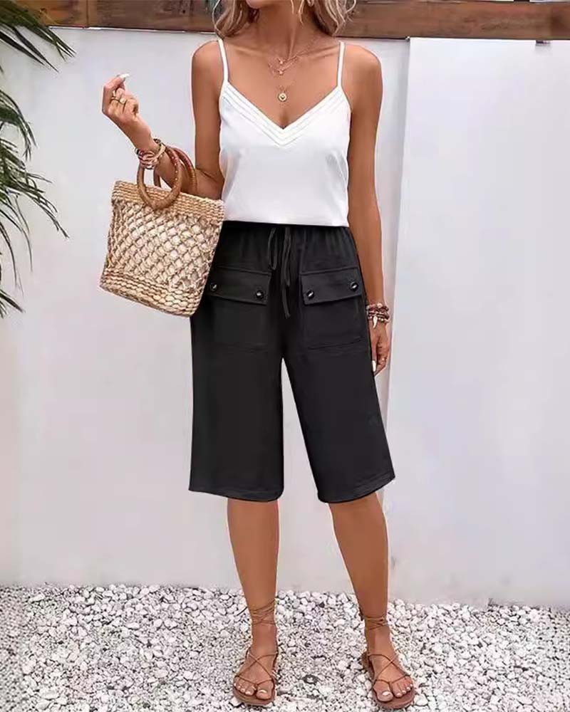 Pantalon mi-long décontracté avec poche de couleur unie