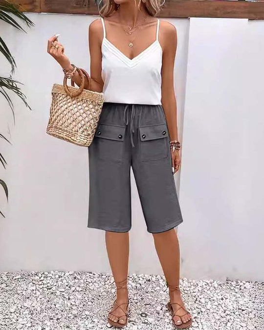 Pantalon mi-long décontracté avec poche de couleur unie
