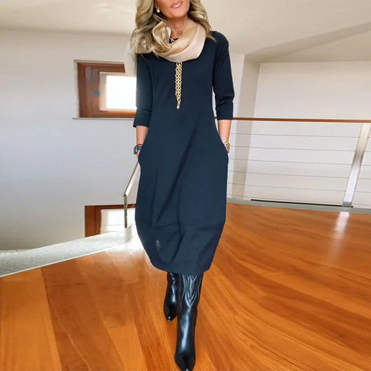 Robe élégante de couleur unie avec poche et col rond